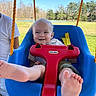 Kash joined the competition — help win amazing prizes! baby, child, swing, blue, red, outdoor, grass, trees, person, feet, smile, playful, sunny, daylight, park, safety_harness, happy, cute, infant, casual