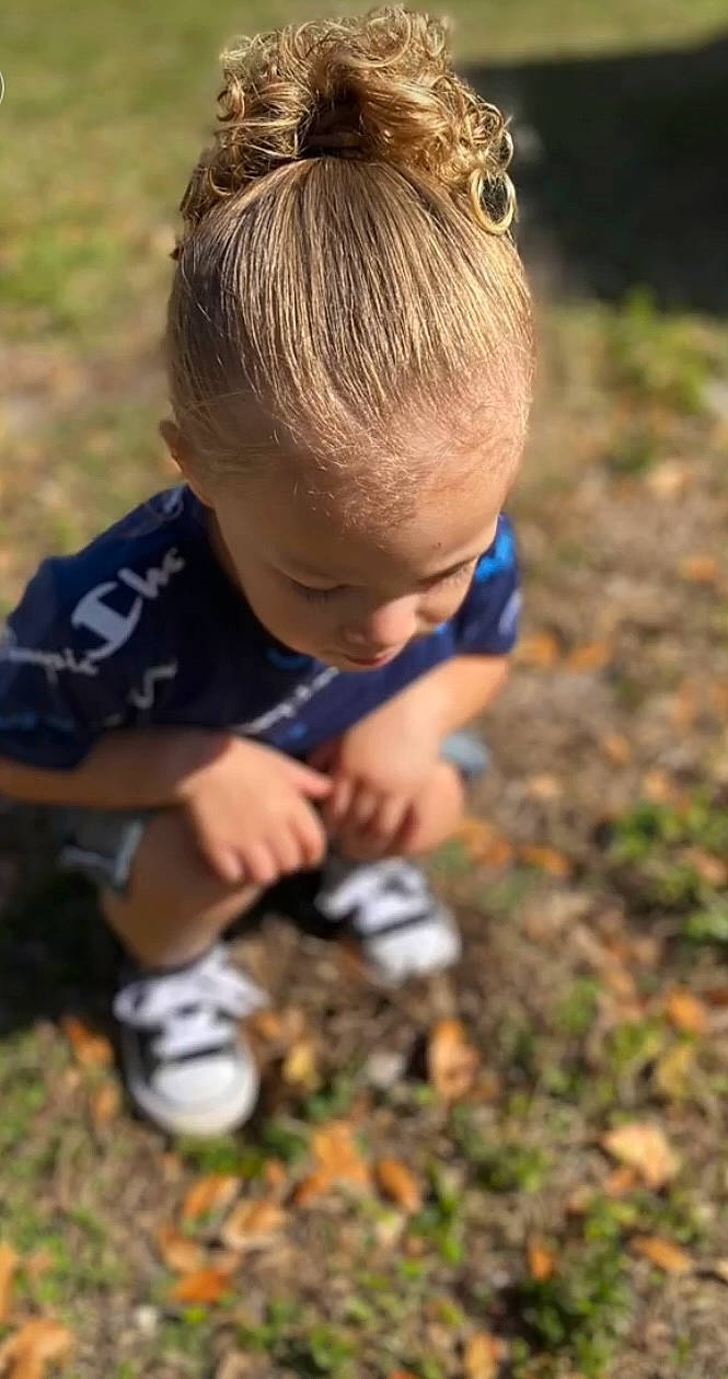 Caylor joined the competition — help win amazing prizes! baby, child, competition_event, electric_blue, gardening, grass, grassland, hair, hand, head, mammal, people_in_nature, person, plant, recreation, shorts, soil, t_shirt, thumb, toddler