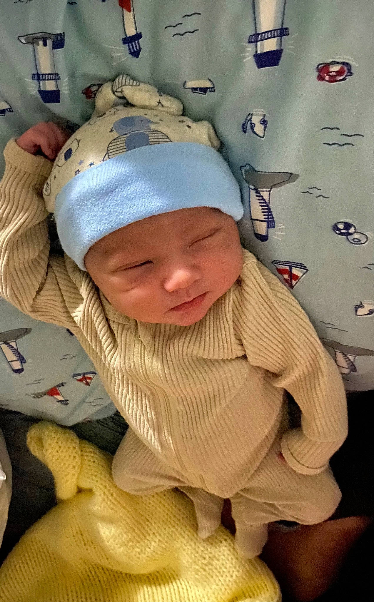Cayde Rieger is registered to the contest to win money with this photo: baby, baby_products, baby_safety, baby_sleeping, baby_toddler_clothing, baseball_cap, cap, cheek, child, comfort, face, fun, happy, headwear, linens, person, room, sitting, skin, sleeve
