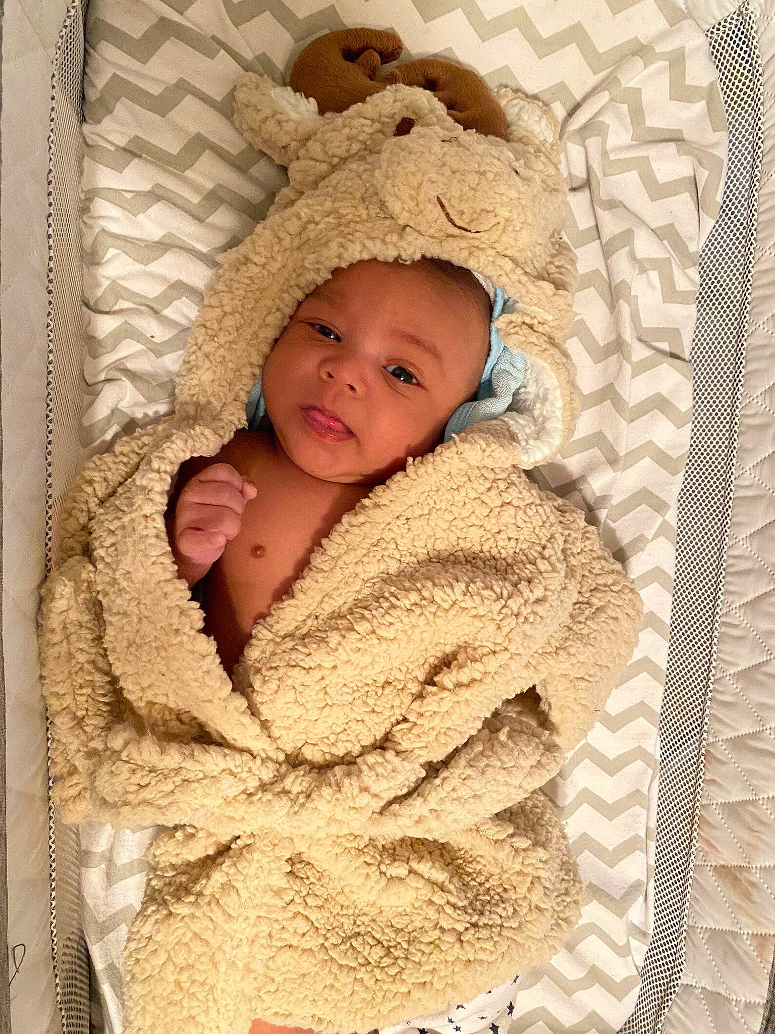 Cayde Rieger joined the competition — help win amazing prizes! baby, baby_sleeping, baby_toddler_clothing, beige, cheek, collar, comfort, face, headgear, knit_cap, linens, pattern, person, skin, sleeve, smile, textile, toddler, wood, wool