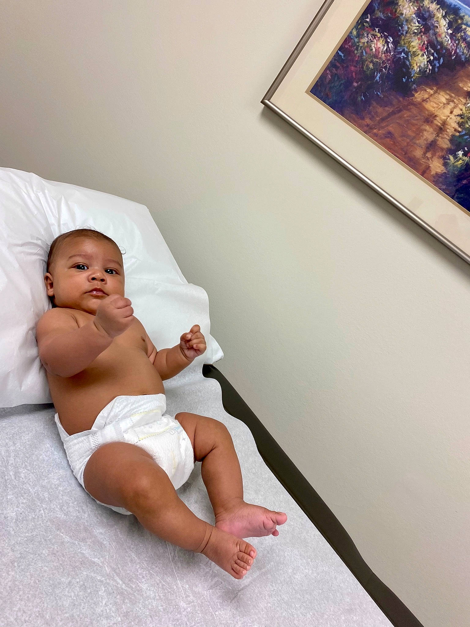 Cayde Rieger is registered to the contest to win money with this photo: abdomen, baby, barefoot, chest, comfort, diaper, elbow, floor, flooring, foot, human_leg, joint, knee, leg, leisure, person, picture_frame, shoulder, stomach, thigh