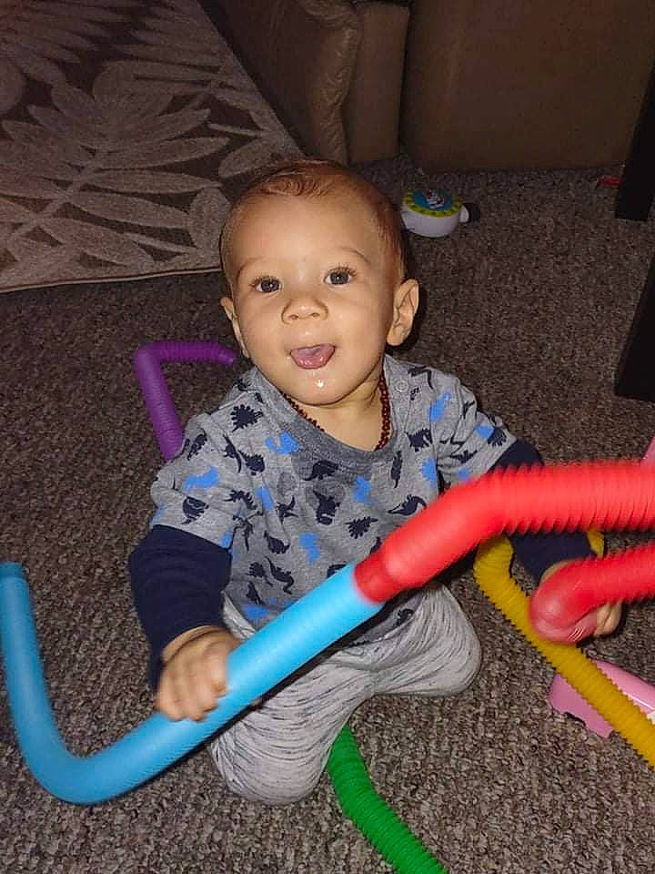 Dreshaun is registered to the contest to win money with this photo: baby, baby_playing_with_toys, baby_products, baby_toddler_clothing, baby_toys, child, electric_blue, flooring, fun, magenta, outdoor_play_equipment, person, plastic, play, sitting, smile, toddler, wood