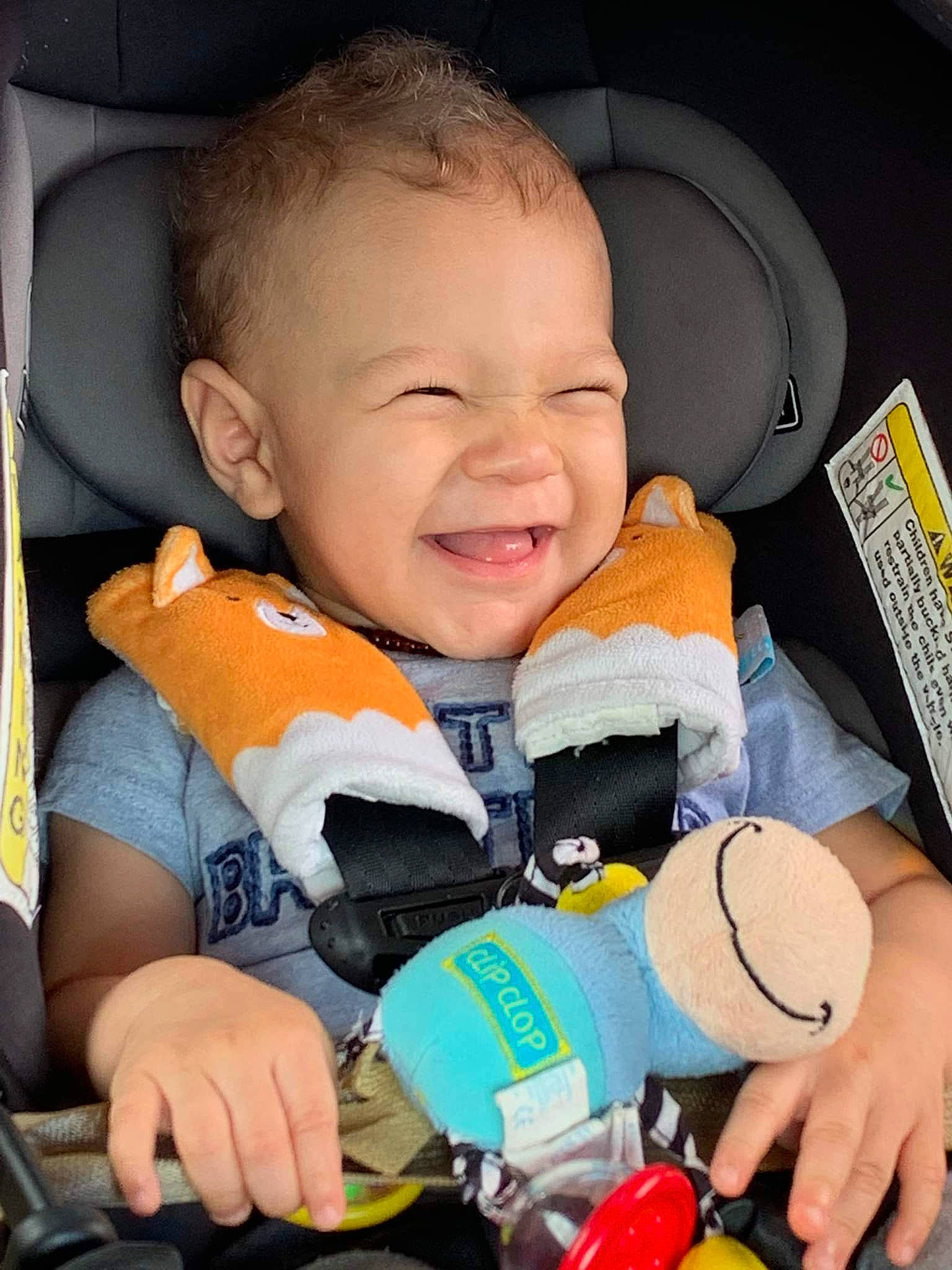 Dreshaun is registered to the contest to win money with this photo: baby, baby_products, baby_toddler_clothing, car_seat, cheek, child, comfort, facial_expression, finger, fun, happy, human, orange, organ, person, photograph, product, skin, smile, thumb