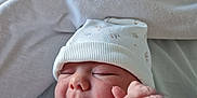 Emma Boucharel participe au concours pour gagner de l'argent avec cette photo : baby, bedding, blanket, clothing, cozy, cute, expression, face, hand, hat, indoors, infant, newborn, peaceful, person, portrait, resting, skin, sleeping, soft