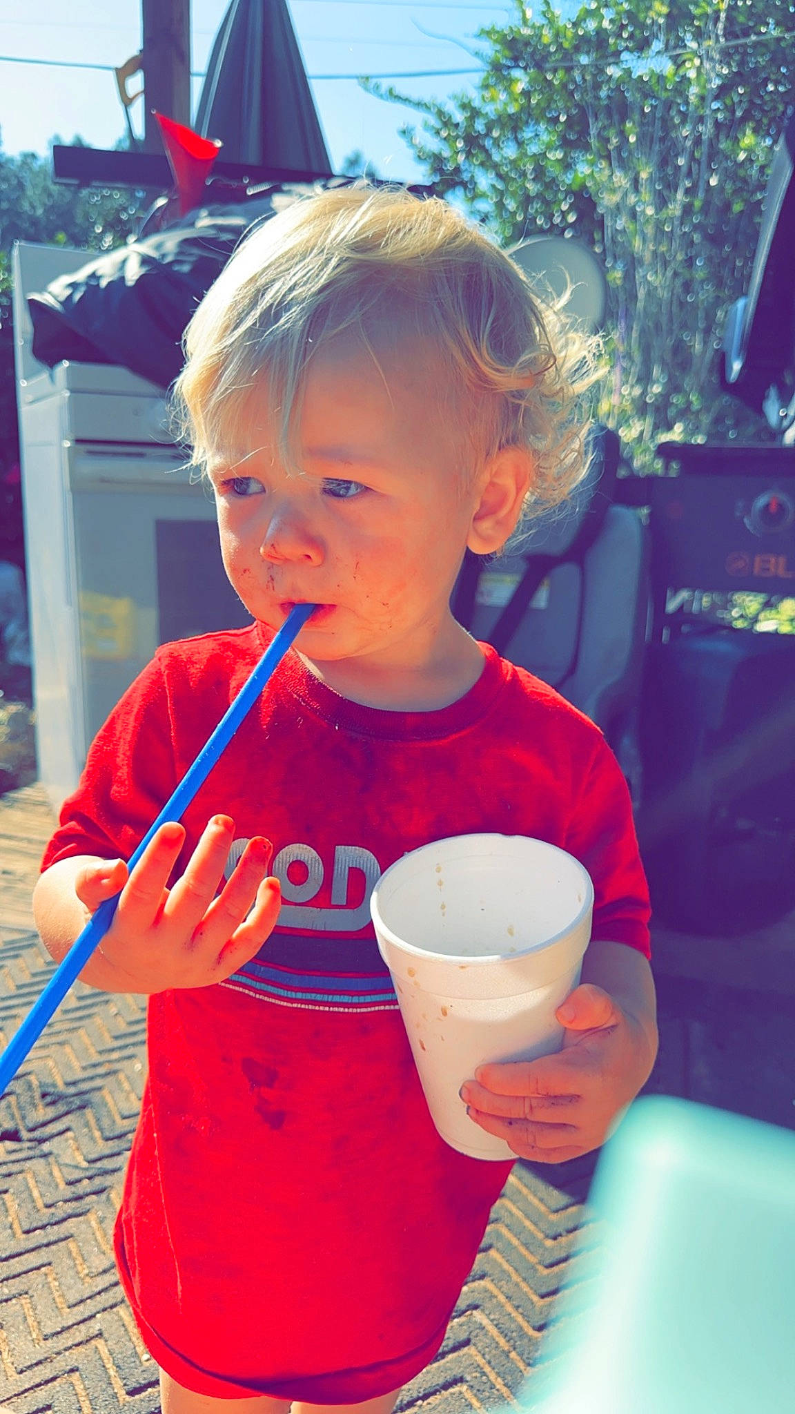 Jaymeson is registered to the contest to win money with this photo: blue, child, drink, drinkware, electric_blue, event, facial_expression, flag, fun, happy, leisure, person, recreation, red, sky, standing, summer, t_shirt, toddler, tree