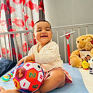 Wahenoor joined the competition — help win amazing prizes! baby, ball, bed, blanket, child, clothing, colorful, curtain, cute, education, happy, indoor, person, playful, room, sitting, smiling, soft_toy, teddy_bear, toy