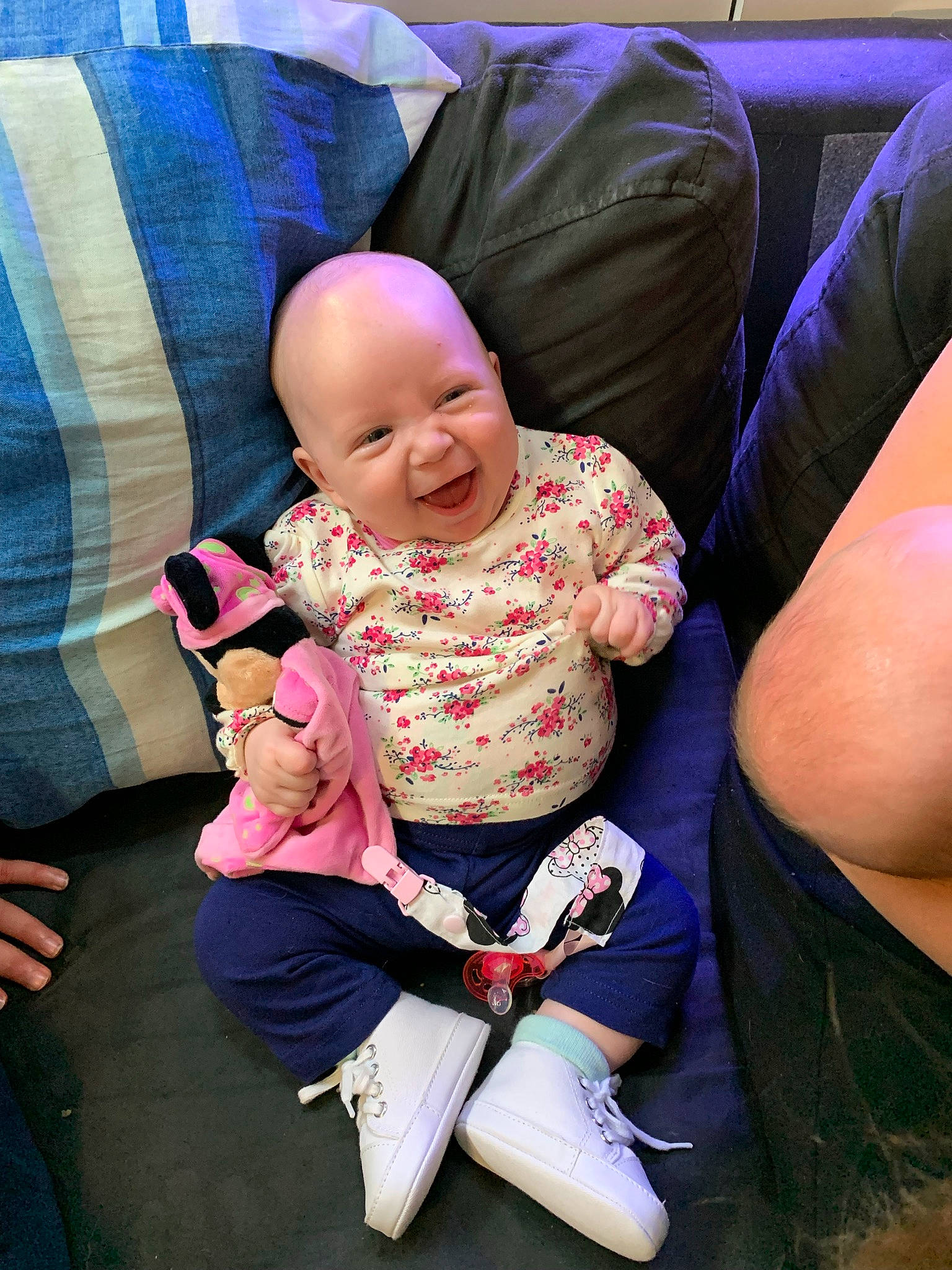 Lilyanna participe au concours pour gagner de l'argent avec cette photo : baby, baby_products, baby_toddler_clothing, child, comfort, couch, event, foot, fun, happy, human_leg, knee, lap, magenta, person, purple, sitting, smile, thigh, thumb