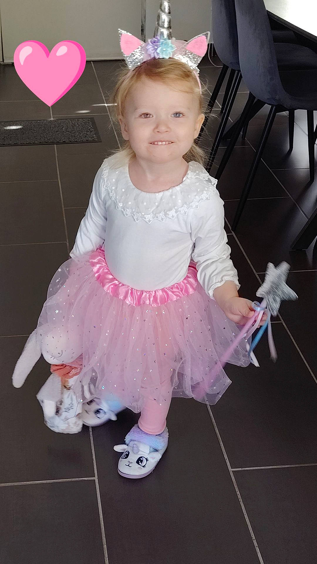 accessories, balloon, child, clothing, costume, dress, face, female, footwear, furniture, girl, head, jewelry, person, photography, portrait, purple, shoe, sitting, skirt