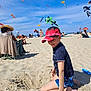 child, boy, beach, sand, kites, sunny, sky, cap, shorts, playing, outdoor, people, relaxing, summer, vacation, fun, colorful, daytime, recreation, leisure