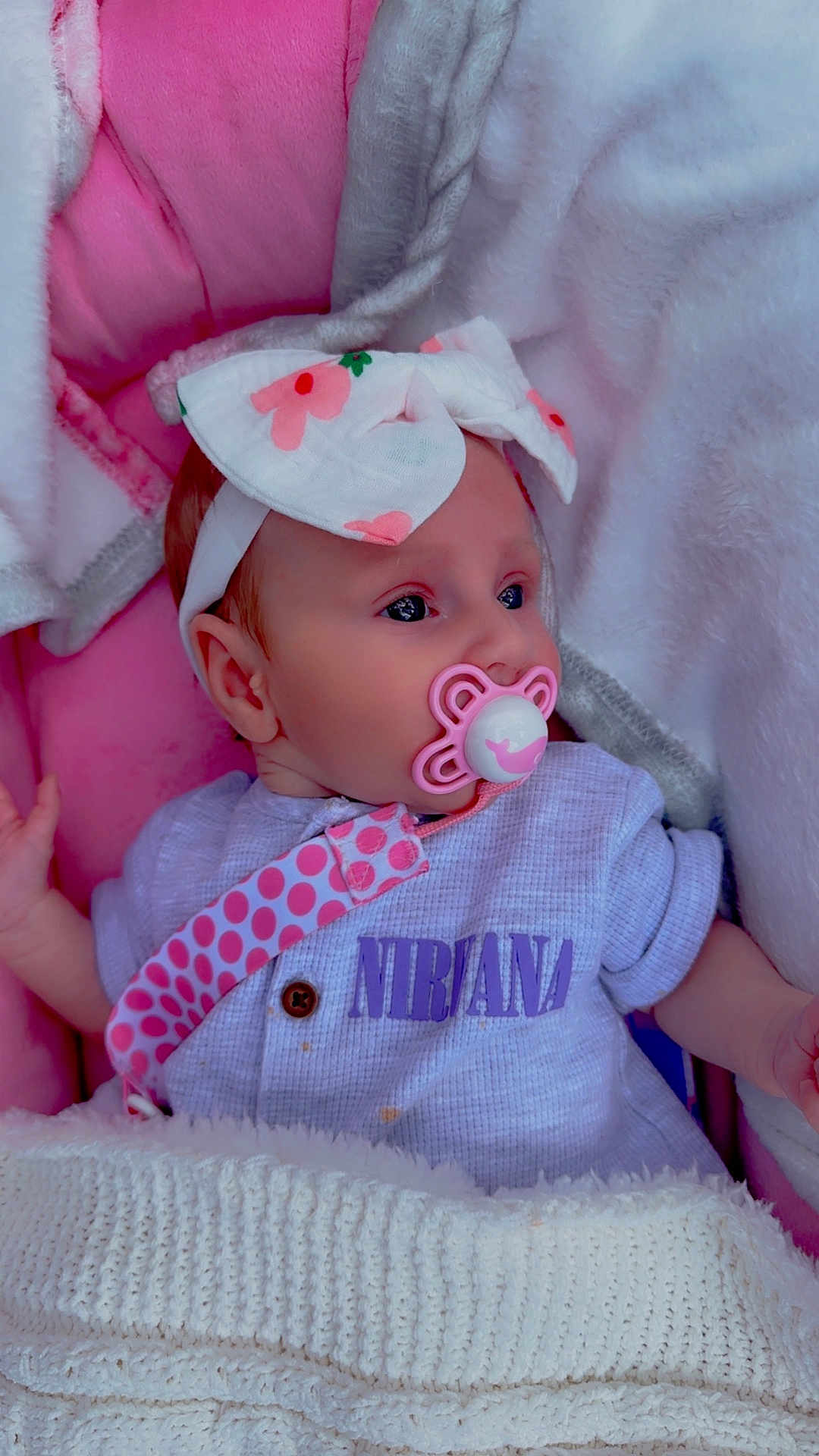 Esmae is registered to the contest to win money with this photo: baby, infant, pacifier, headband, blanket, pink, white, clothing, onesie, polka_dot, strap, face, sleeping, resting, cute, soft_texture, cozy, child, portrait, indoors
