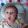 Esmae joined the competition — help win amazing prizes! baby, bee_pattern, blue_eyes, child, clothing, cushion, expression, face, floral_pattern, head_support, indoor, infant, person, pink, plush_toy, seat, star_shaped, surprised, white, yellow