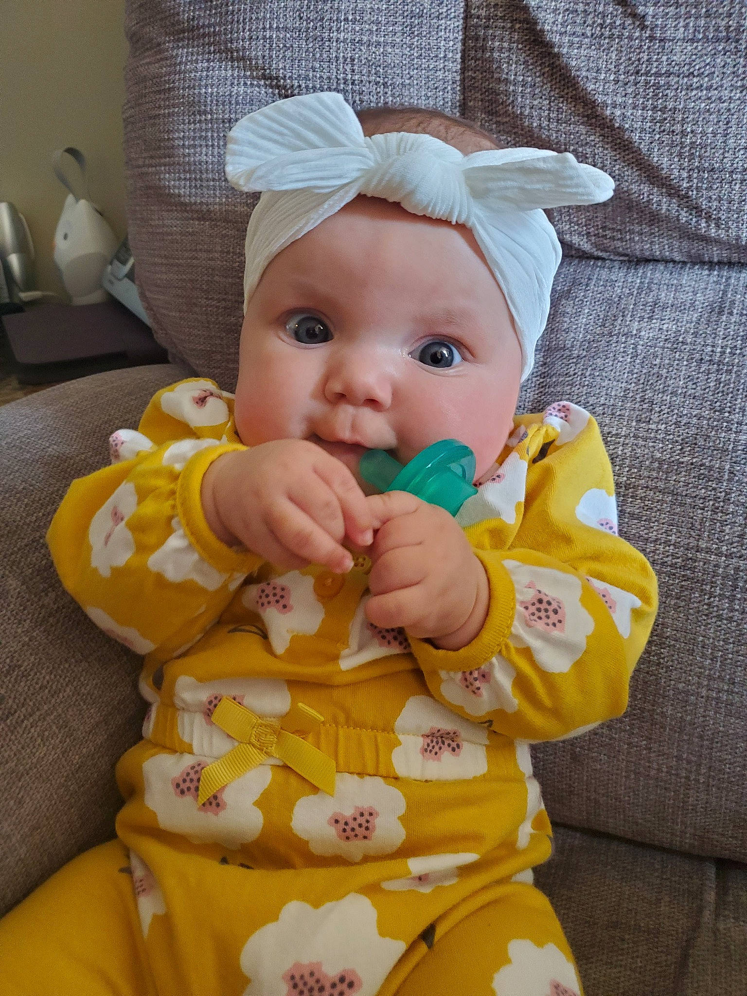 Kori is registered to the contest to win money with this photo: baby, cheek, child, headwear, person, skin, toddler, yellow