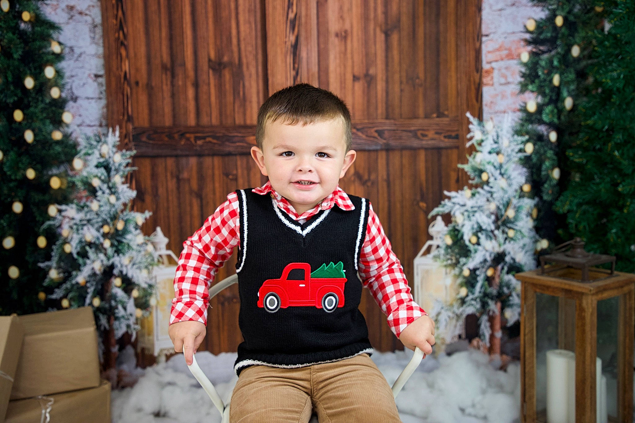 Brycen is registered to the contest to win money with this photo: baby_toddler_clothing, christmas_decoration, christmas_ornament, christmas_tree, event, green, happy, holiday, holiday_ornament, joy, light, person, photograph, plant, red, sleeve, smile, standing, toddler, tree