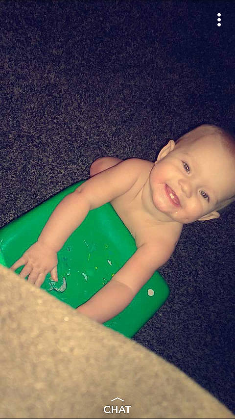 Kailey is registered to the contest to win money with this photo: arm, child, finger, fun, girl, green, hand, infant, leg, mouth, person, skin, smile, toddler