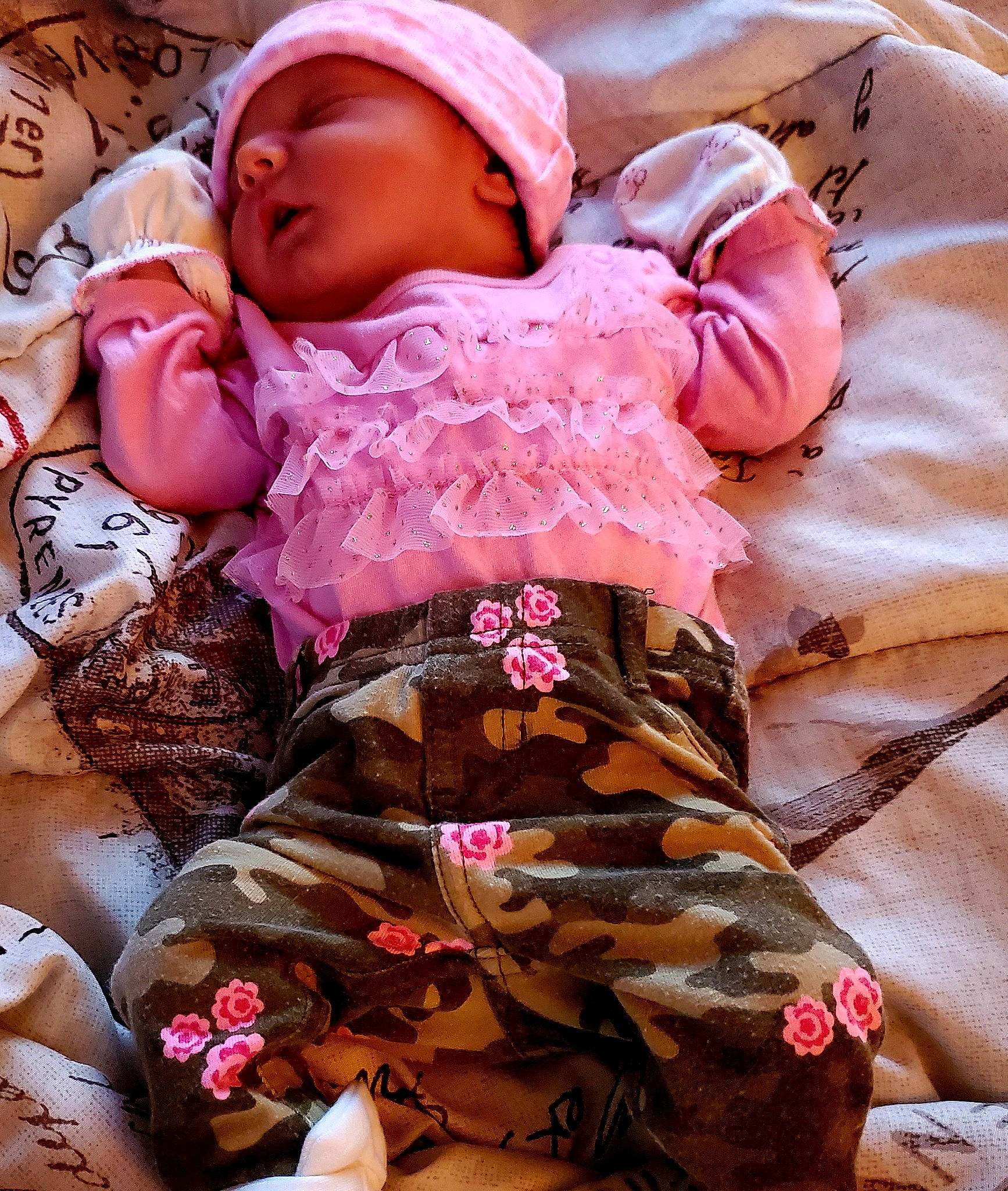 Aubrey is registered to the contest to win money with this photo: abdomen, baby, baby_products, baby_safety, baby_sleeping, baby_toddler_clothing, cheek, child, comfort, fashion_accessory, linens, magenta, pattern, person, pink, purple, skin, sleeve, textile, thigh