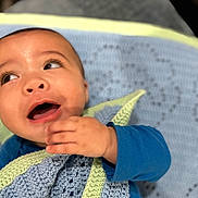 Khylae joined the competition — help win amazing prizes! baby, infant, child, blanket, crochet, blue_clothing, hand, face, smile, happy, portrait, cute, young, skin, head, eyes, mouth, indoors, cozy, warm