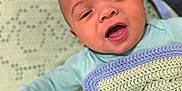 Kyael joined the competition — help win amazing prizes! baby, infant, blanket, crocheted_blanket, smiling, happy, face, head, mouth_open, clothing, light_blue, soft_lighting, indoors, person, cute, young_child, lying_down, hand, skin, cozy