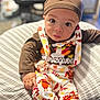 baby, brown, child, clothing, cute, face, hat, indoor, infant, orange, pattern, person, pillow, portrait, sitting, suspenders, thanksgiving, turkey, white, yellow