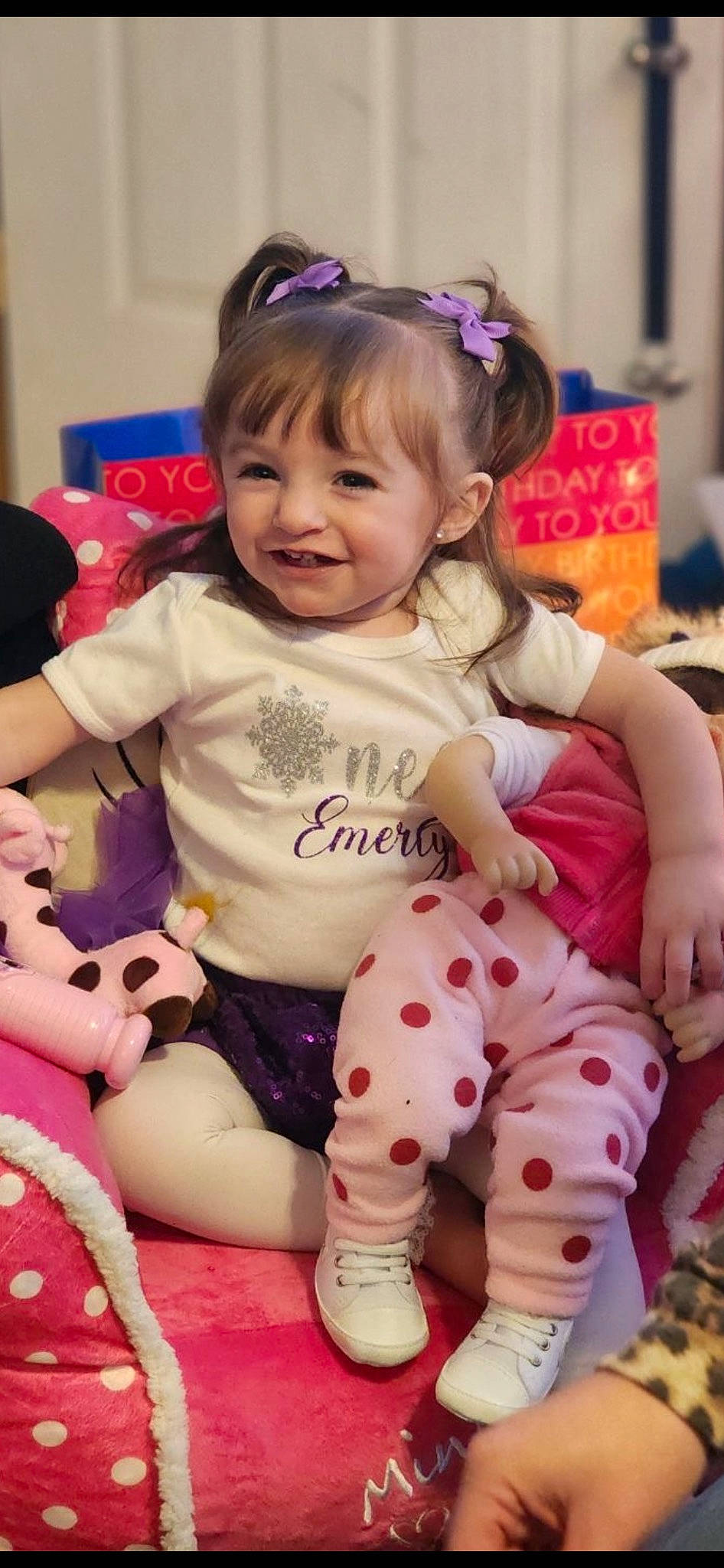 Emerly is registered to the contest to win money with this photo: baby, baby_toddler_clothing, blue, cheek, face, facial_expression, fun, happy, head, human, iris, joy, organ, person, pink, purple, skin, sleeve, smile, sock