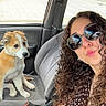 Baïko a rejoint le concours — aidez-le/la à gagner de superbes lots ! woman, puppy, dog, car_interior, seat, curly_hair, sunglasses, selfie, casual, pet, cute, daylight, window, smile, portrait, seatbelt, clothing, road, outdoor, animal