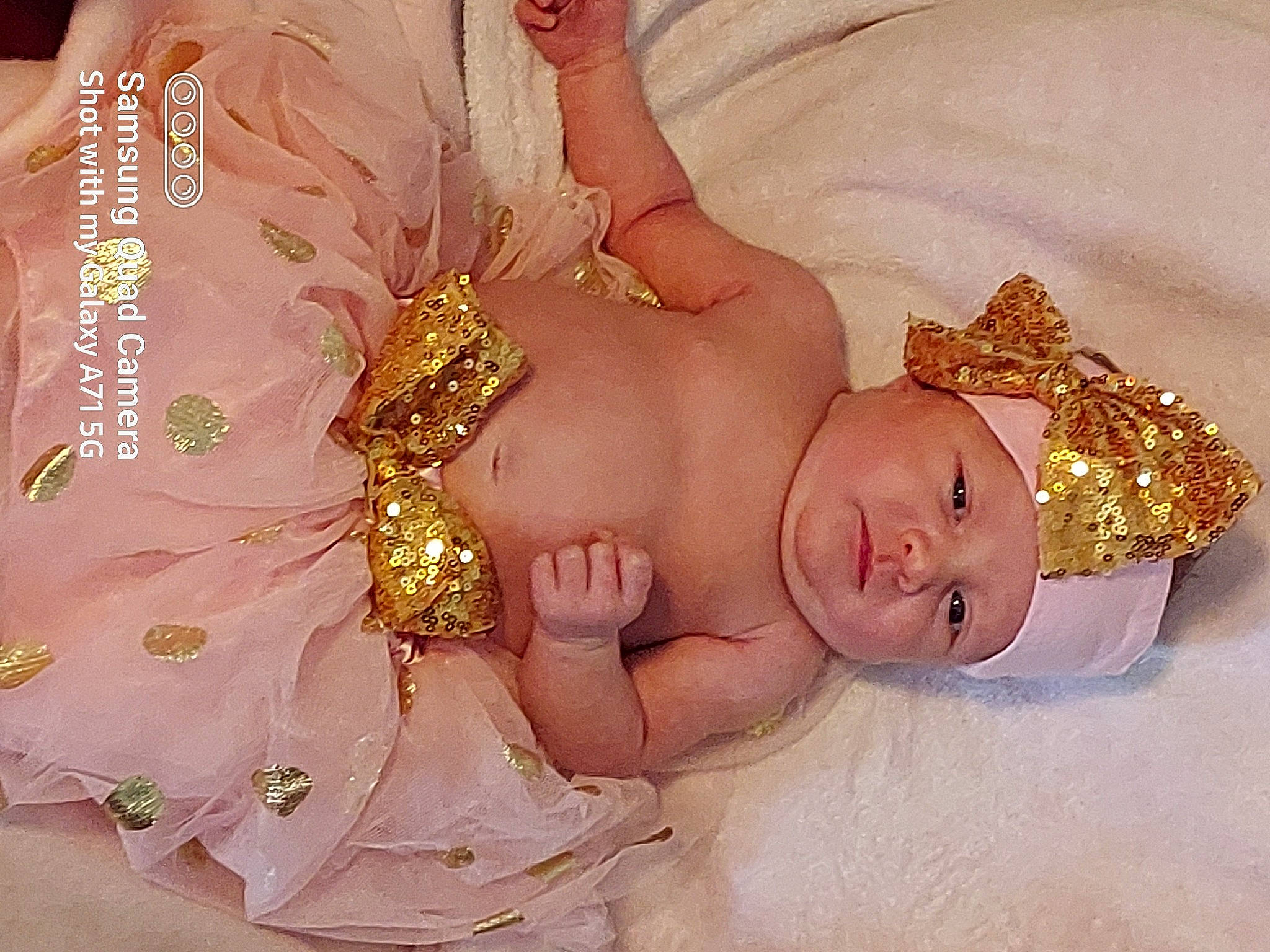 Chloe joined the competition — help win amazing prizes! abdomen, arm, baby, baby_toddler_clothing, bridal_accessory, dress, eye, finger, happy, head, headpiece, headwear, human_body, jewellery, nail, person, pink, skin, textile, tiara