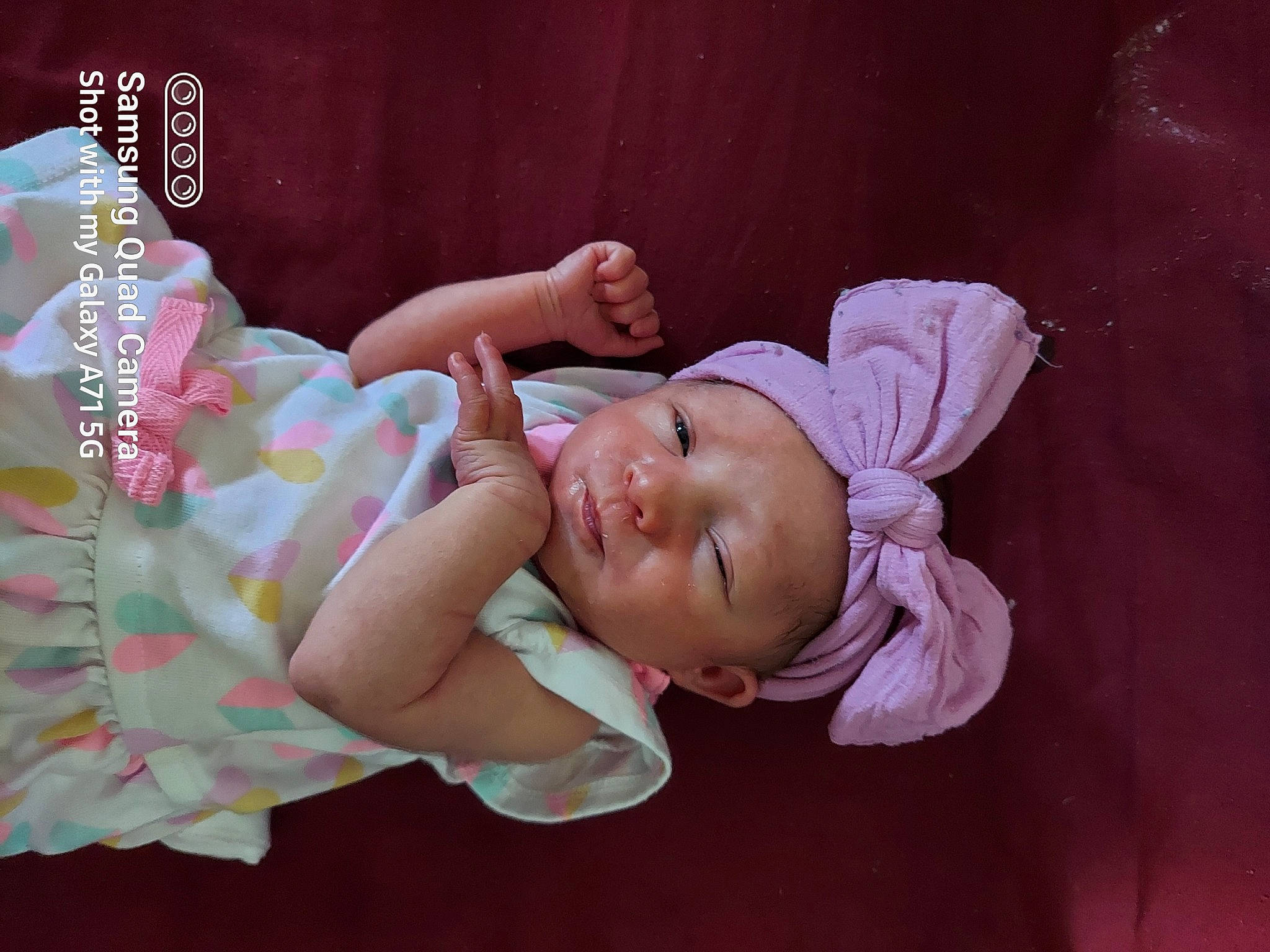 Chloe Leeann Scott is registered to the contest to win money with this photo: arm, baby, baby_products, baby_sleeping, baby_toddler_clothing, cheek, child, comfort, eyelash, fashion_accessory, happy, headpiece, headwear, linens, magenta, pattern, person, pink, portrait_photography, room
