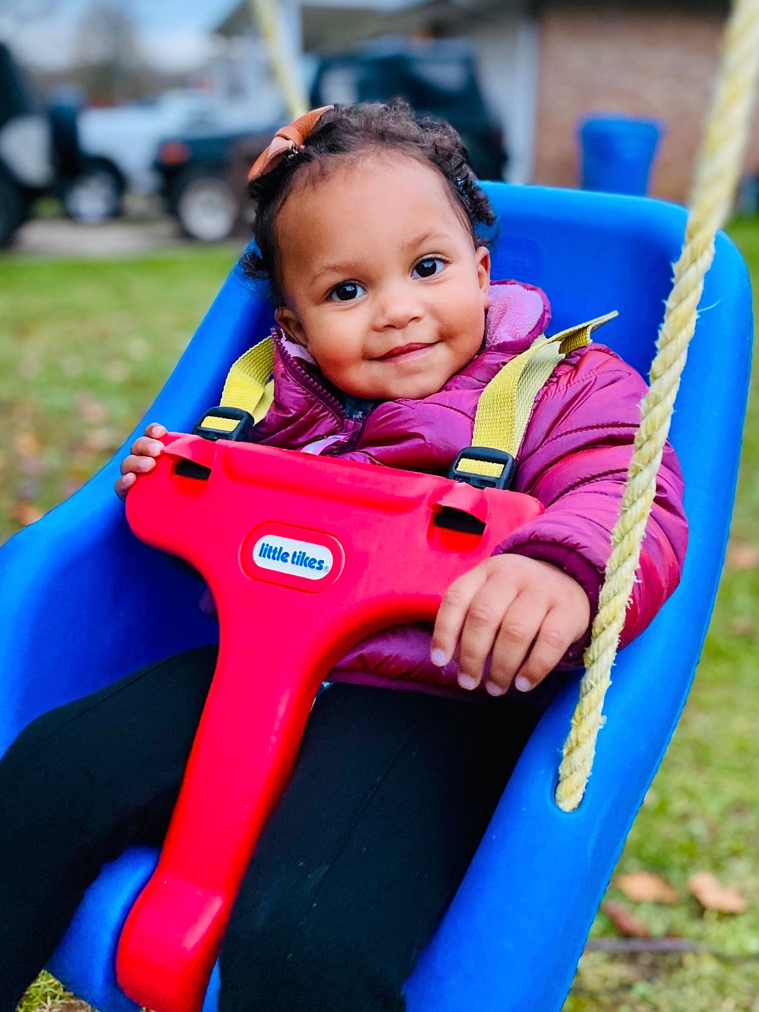 Ariana is registered to the contest to win money with this photo: baby_toddler_clothing, blue, child, chute, city, electric_blue, face, grass, hand, happy, head, joy, leisure, magenta, outdoor_play_equipment, people_in_nature, person, playground, recreation, smile