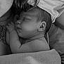 Olympe participe au concours pour gagner de l'argent avec cette photo : baby, newborn, sleeping, black_and_white, tattoo, blanket, skin, closeup, comfort, rest, peaceful, infant, human, portrait, cuddle, parent, love, soft, face, ear