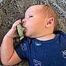 Wyatt is registered to the contest to win money with this photo: baby, infant, pacifier, blanket, blue_onesie, face, hand, skin, cute, lying_down, sleepwear, soft_texture, newborn, child, portrait, resting, comfort, indoor, young, expression