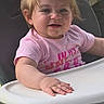 toddler, child, high_chair, pink_shirt, pony_tail, hair_ties, outdoor, grass, table, yellow_pants, baby, cute, smiling, person, young_child, seat, plastic_chair, sunlight, happy, portrait