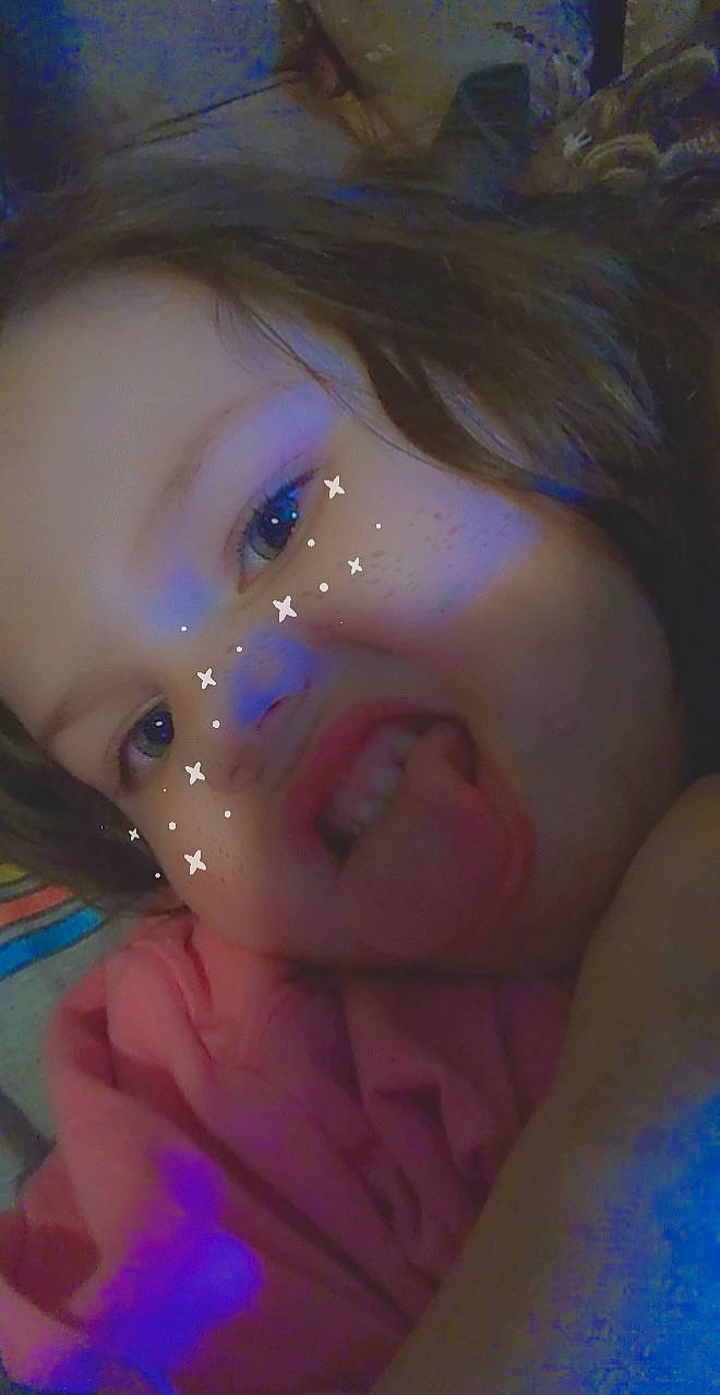 Kelly is registered to the contest to win money with this photo: cheek, ear, eye, eyebrow, eyelash, forehead, gesture, hand, happy, human_body, iris, jaw, lip, mouth, neck, nose, person, purple, skin, smile