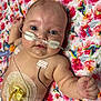 Serenity is registered to the contest to win money with this photo: baby, blue_eyes, child, chubby_cheeks, closeup, cute, cute_baby, diaper, floral_blanket, healthcare, hospital, hummingbird_pattern, infant, lying_down, medical_patches, medical_tubes, monitoring, newborn, person, skin
