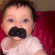 Iris is registered to the contest to win money with this photo: baby, blanket, blue_eyes, bow, candid, child, closeup, cute, expression, face, hair, indoor, infant, pacifier, person, pink_clothing, portrait, skin, soft_texture, young_child