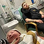 Jac joined the competition — help win amazing prizes! baby, beard, bed, blanket, calm, chair, hospital, indoor, knitwear, man, medical_equipment, monitor, newborn, patient_room, person, resting, sink, sleeping, tattoo, tshirt