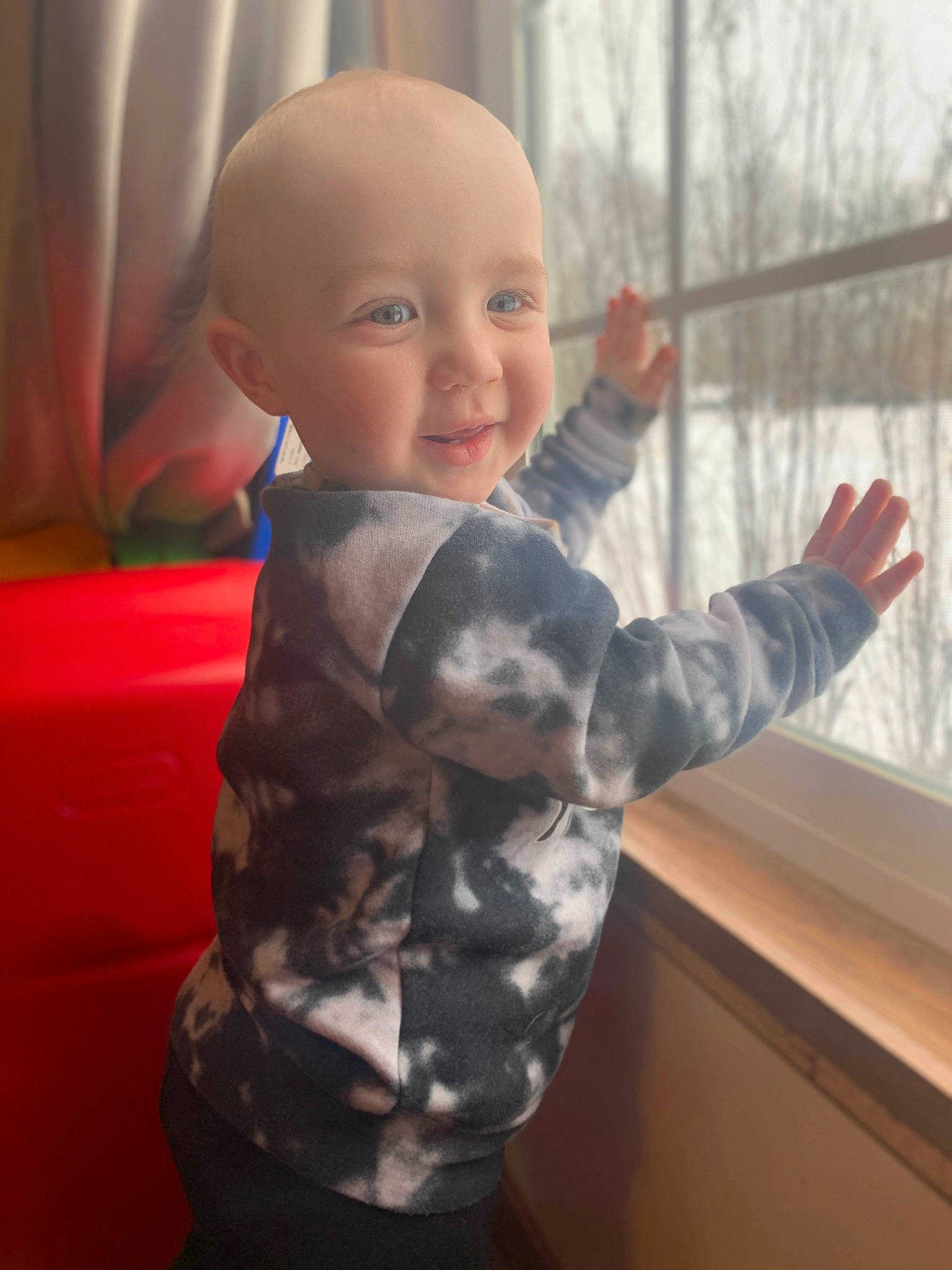 Corbyn is registered to the contest to win money with this photo: baby, baby_toddler_clothing, eye, finger, fun, gesture, happy, human_body, joint, nose, person, pink, shoulder, skin, sleeve, smile, standing, thumb, toddler, toy