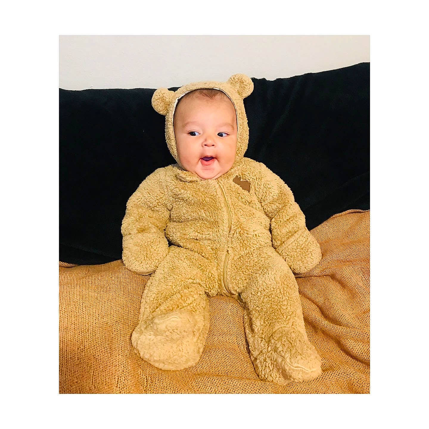 Dominik joined the competition — help win amazing prizes! baby, baby_toddler_clothing, beige, child, clothing, collar, face, fashion_accessory, fur, fur_clothing, headgear, hood, linens, neck, pattern, peach, person, sitting, sleeve, smile