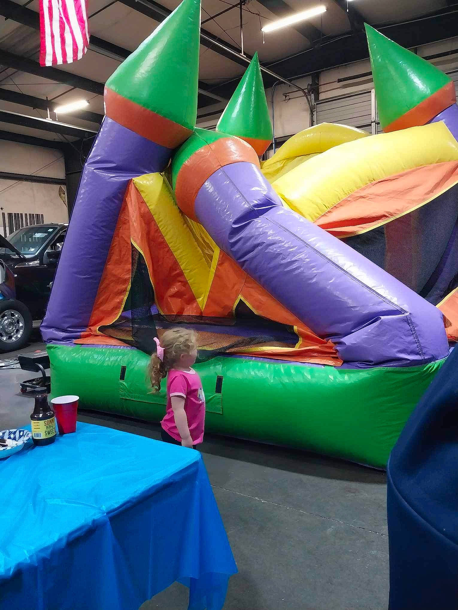 Hadley joined the competition — help win amazing prizes! bounce_house, child, chute, entertainment, event, fun, games, green, inflatable, leisure, mammal, outdoor_play_equipment, performance, person, play, playground, public_event, recreation, snapshot, table