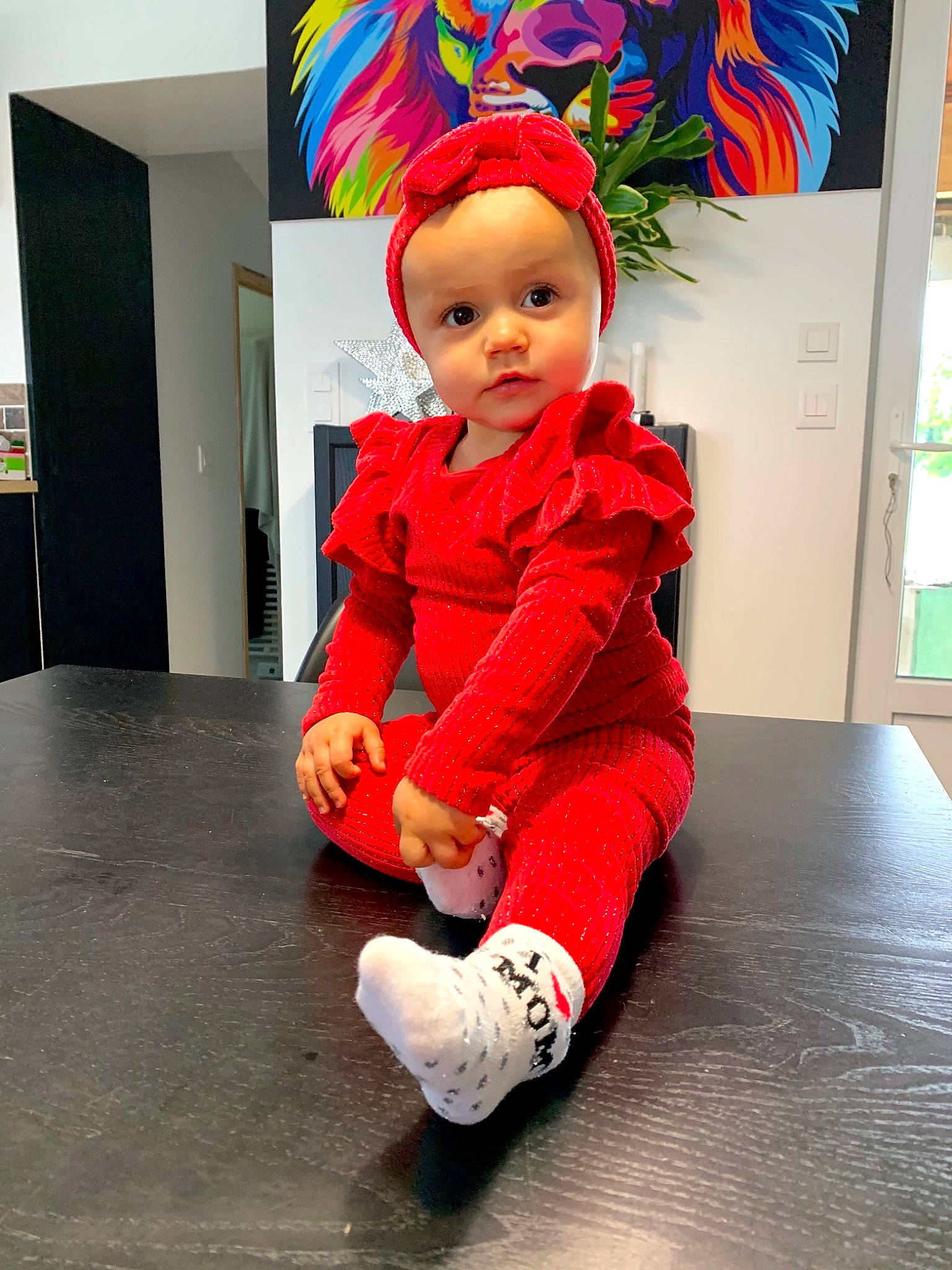 Molly participe au concours pour gagner de l'argent avec cette photo : art, baby, baby_toddler_clothing, carmine, child, floor, flooring, fun, fur, happy, hardwood, hat, human_leg, magenta, pattern, person, room, sitting, sleeve, toddler