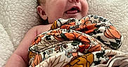 Ottalee Jo joined the competition — help win amazing prizes! baby, blanket, child, comfort, cozy, cushion, cute, expression, eyes, face, floral_pattern, happy, head, indoors, infant, mouth, newborn, person, skin, smiling