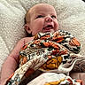 Ottalee Jo joined the competition — help win amazing prizes! baby, infant, smiling, blanket, floral_pattern, cushion, cozy, happy, face, head, skin, eyes, mouth, expression, person, child, indoors, comfort, cute, newborn