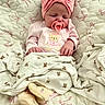 Ottalee Jo is registered to the contest to win money with this photo: baby, sleeping, pacifier, headband, blanket, teddy_bear_pattern, pink_clothing, soft_toys, infant, cute, cozy, bed, sleepwear, footwear, child, newborn, portrait, resting, indoors, comfort
