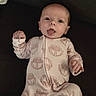 Ottalee Jo is registered to the contest to win money with this photo: baby, infant, onesie, face, tongue, expression, cute, lying_down, child, patterned_clothing, hand, foot, sleepwear, indoors, young, person, newborn, skin, head, playful