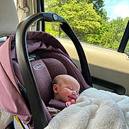 Ottalee Jo is registered to the contest to win money with this photo: baby, blanket, car_interior, car_seat, child, daylight, fabric, greenery, head_support, infant, pacifier, peaceful, portrait, relaxation, seatbelt, sleeping, smile, soft, transportation, window
