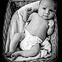 Thaïs participe au concours pour gagner de l'argent avec cette photo : baby, infant, wicker_basket, blanket, diaper, black_and_white, portrait, cute, child, newborn, relaxing, soft_texture, lying_down, small_hands, small_feet, curious_look, indoor, cozy, monochrome, closeup