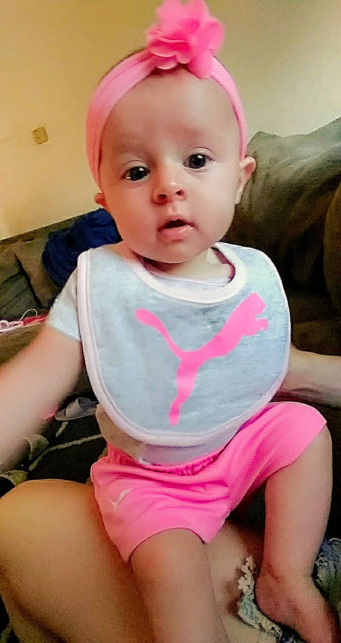 Aubrie is registered to the contest to win money with this photo: baby, baby_toddler_clothing, cheek, child, mouth, person, pink, skin, toddler