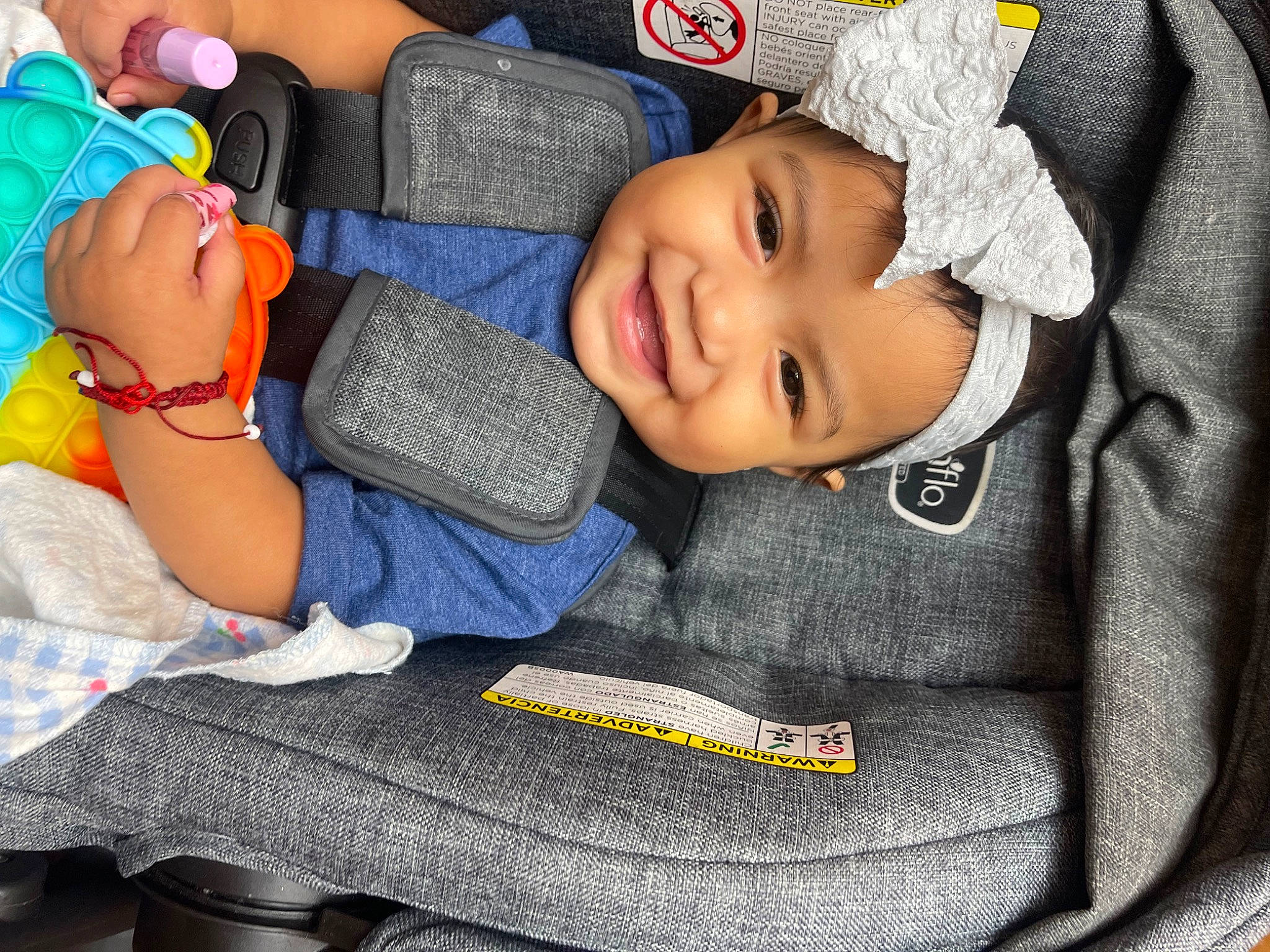 Jazmine is registered to the contest to win money with this photo: auto_part, baby, baby_in_car_seat, baby_products, baby_sleeping, baby_toddler_clothing, cap, car_seat, child, comfort, electric_blue, fun, happy, hat, headwear, joy, mouth, nail, person, smile