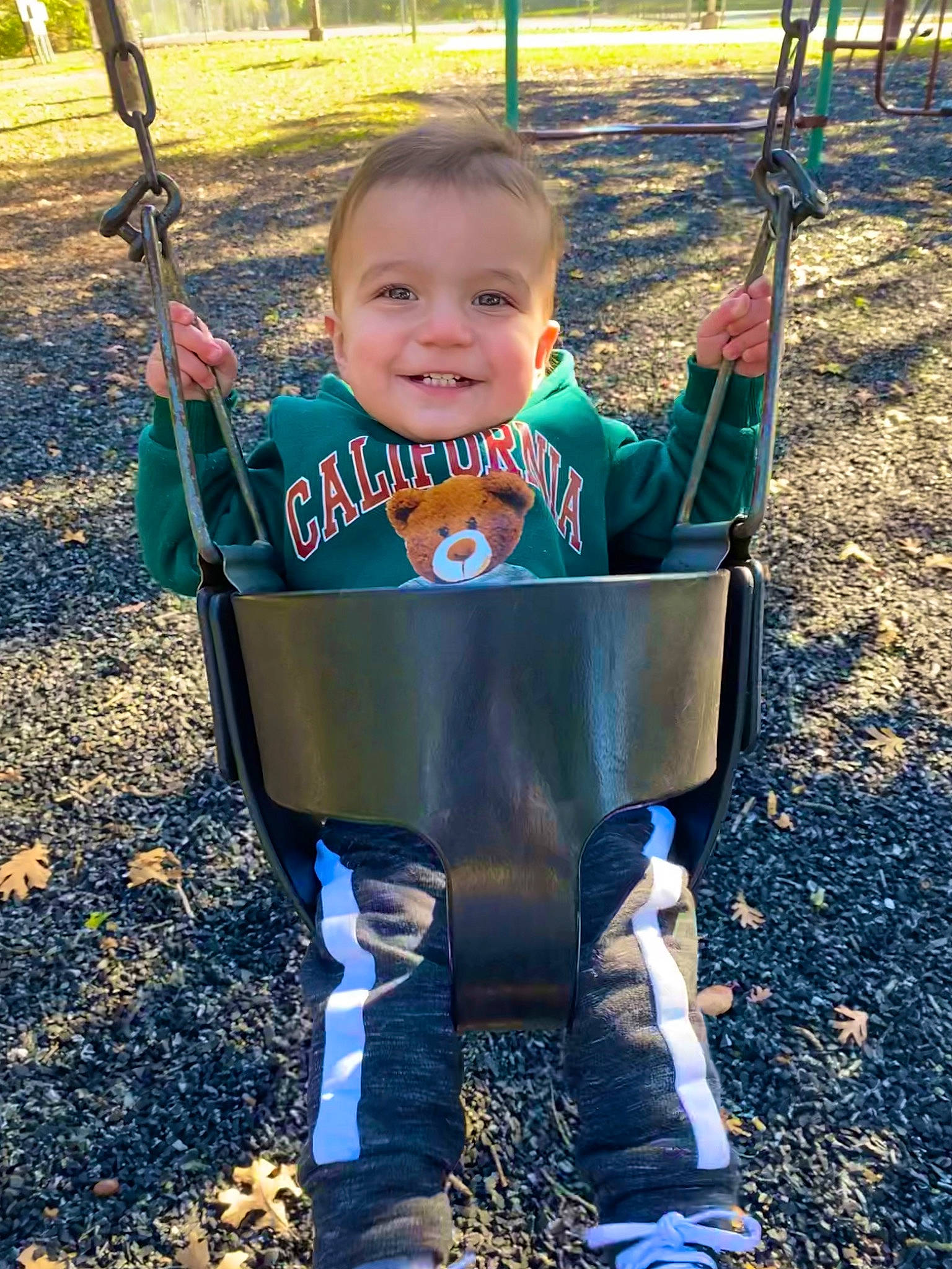 Izaiah is registered to the contest to win money with this photo: baby, baby_toddler_clothing, child, city, electric_blue, fun, grass, happy, head, joy, leisure, nature, people_in_nature, person, plant, playground, recreation, sleeve, smile, swing