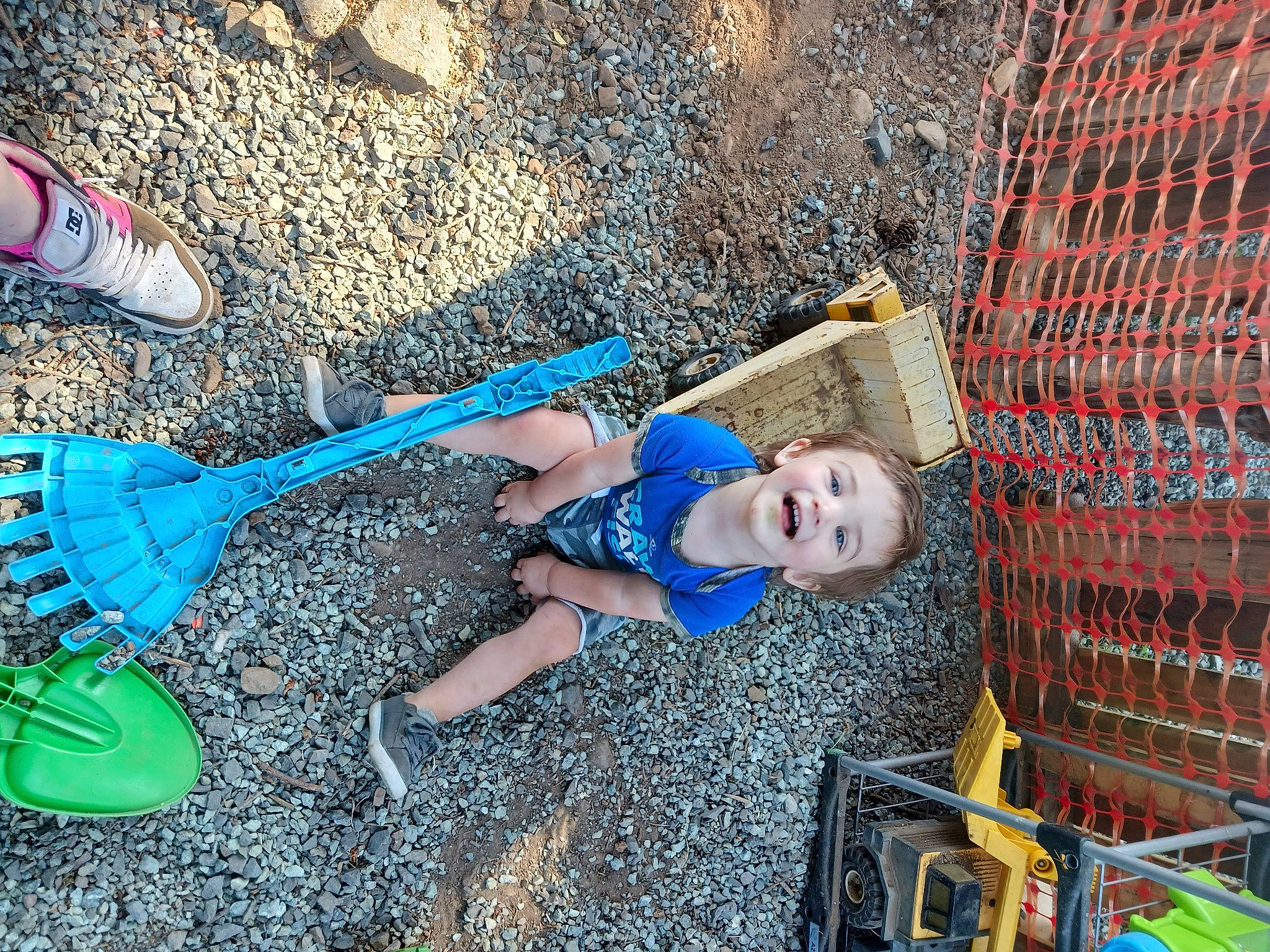 Aden is registered to the contest to win money with this photo: baby, baby_products, baby_toddler_clothing, blue, cart, child, city, electric_blue, fun, grass, human_leg, leisure, mesh, people_in_nature, person, play, recreation, shadow, smile, soil