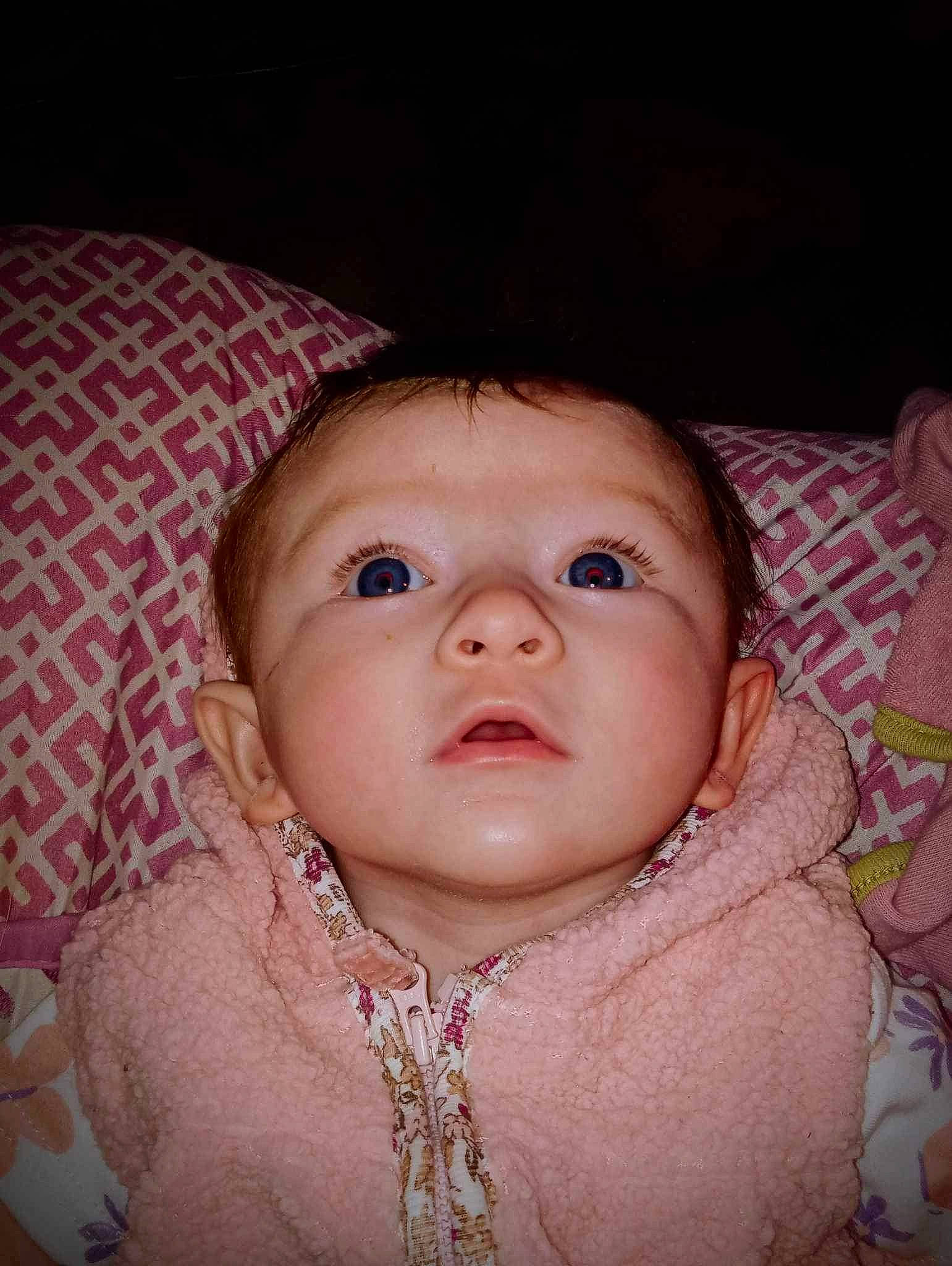 Lily is registered to the contest to win money with this photo: baby, baby_toddler_clothing, cheek, chin, comfort, eye, eyebrow, eyelash, facial_expression, happy, head, iris, linens, lip, mouth, nose, person, pink, skin, sleeve
