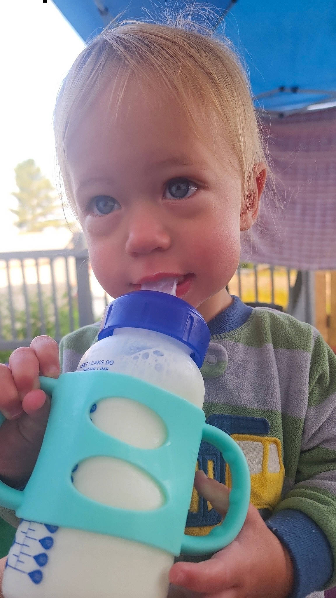 Buckley joined the competition — help win amazing prizes! baby, baby_bottle, baby_products, baby_toddler_clothing, bottle, child, drink, drinking, drinkware, electric_blue, finger, happy, liquid, nail, person, plastic, plastic_bottle, skin, thumb, toddler